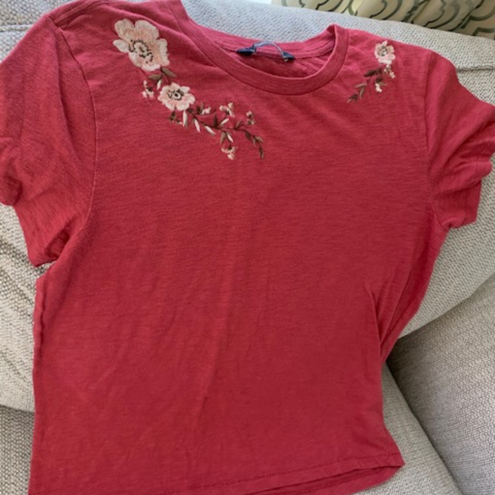 Shirt with floral embellishment
